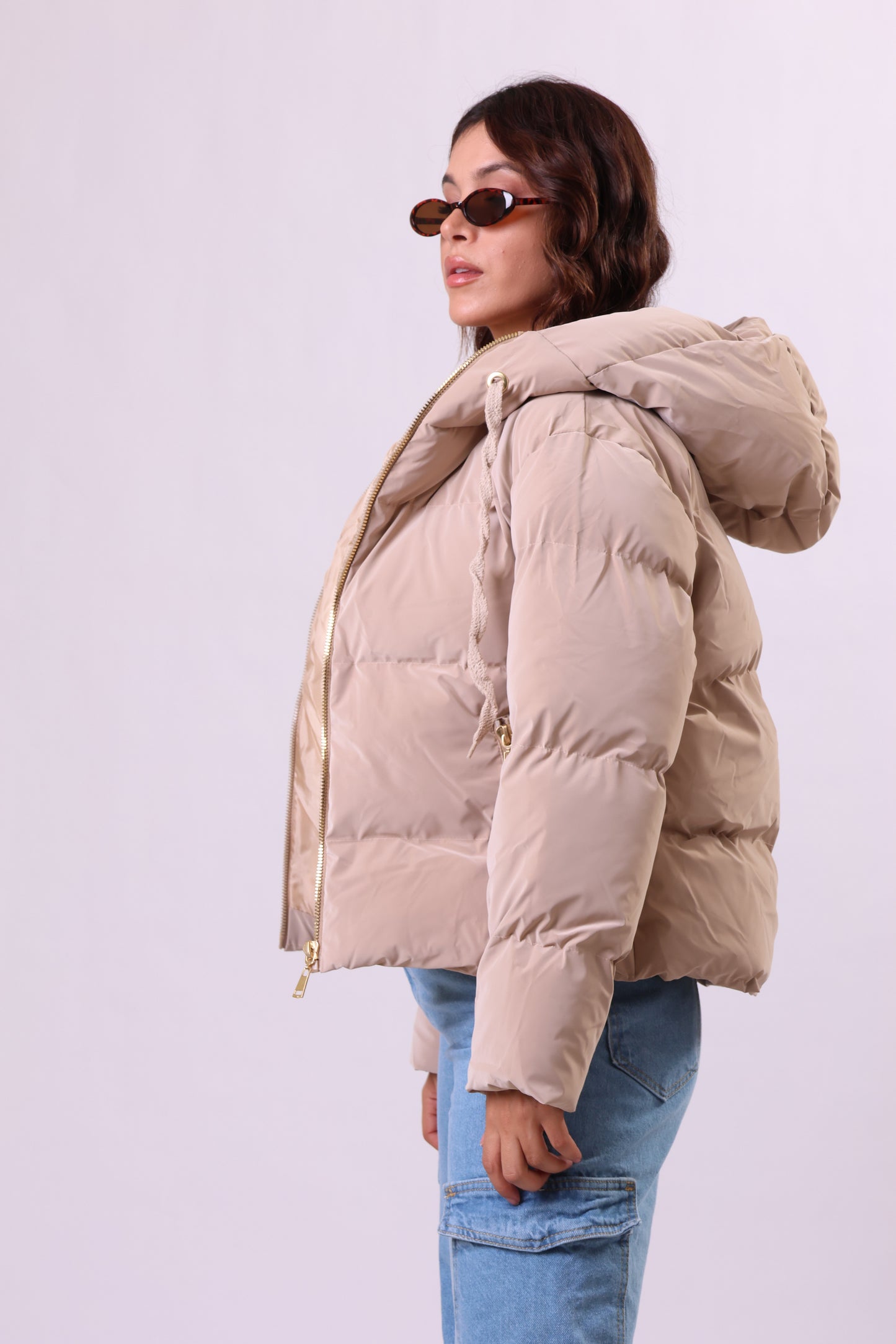 Puffer jacket in beige.