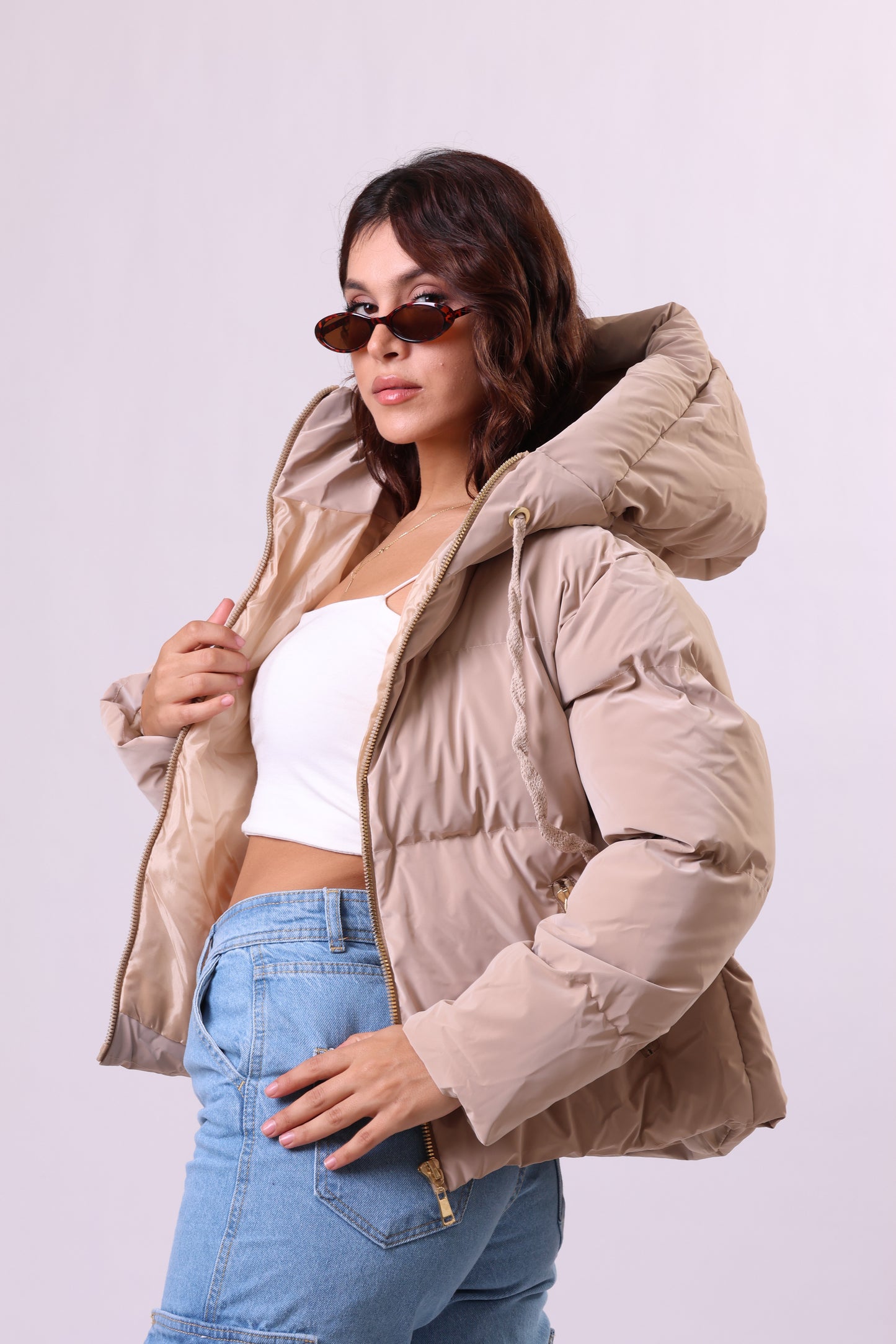 Puffer jacket in beige.